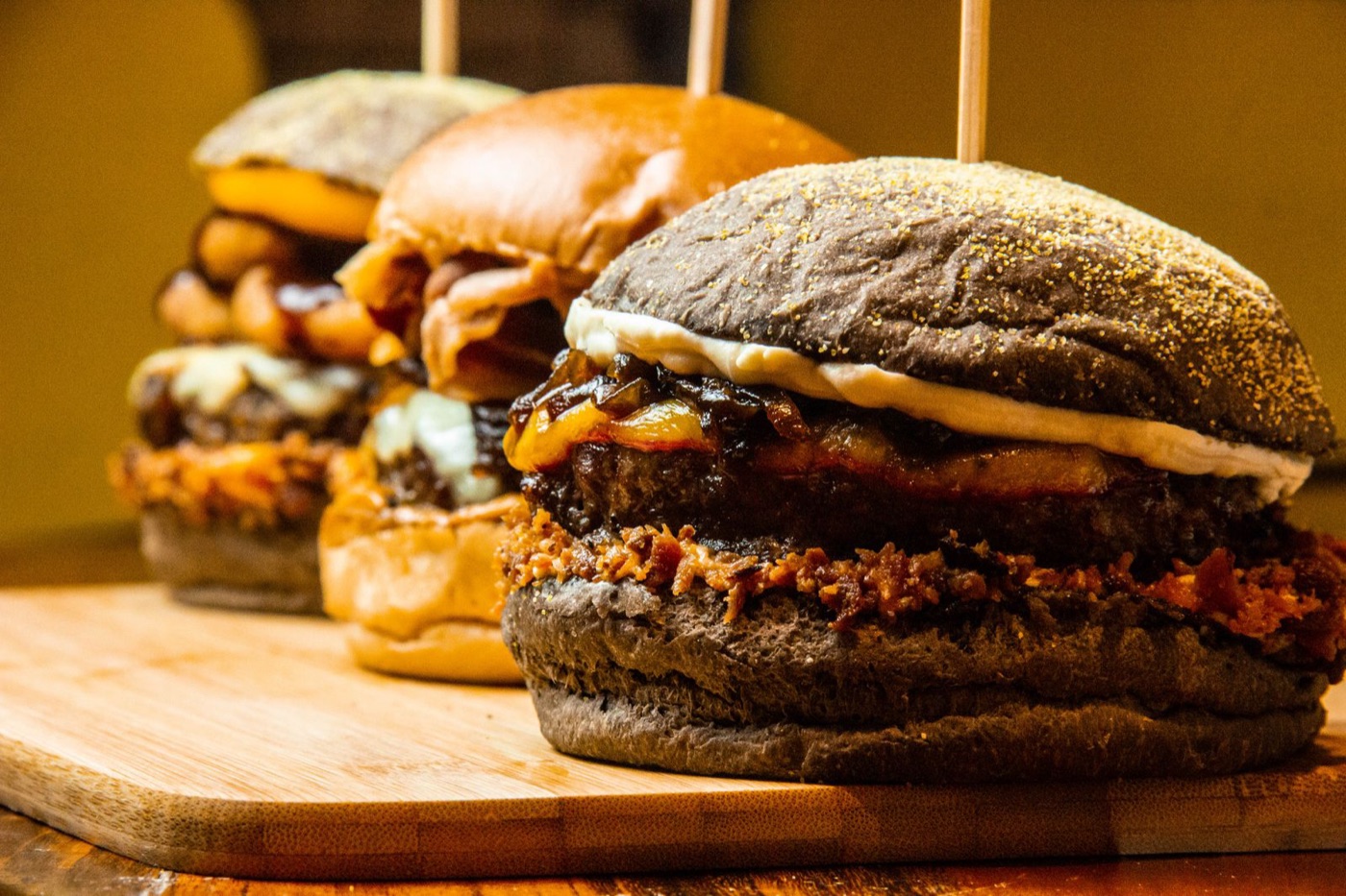 Gourmet burgers on a wooden board