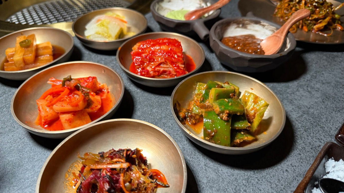 Korean banchan side dishes in metal bowls